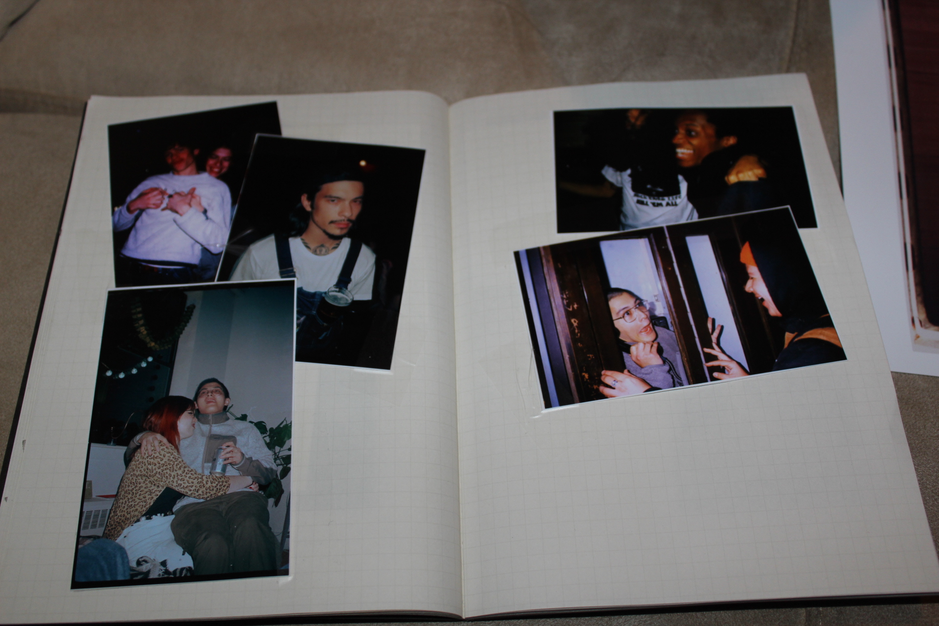 chris' notebook where he has taped pictures of his friends