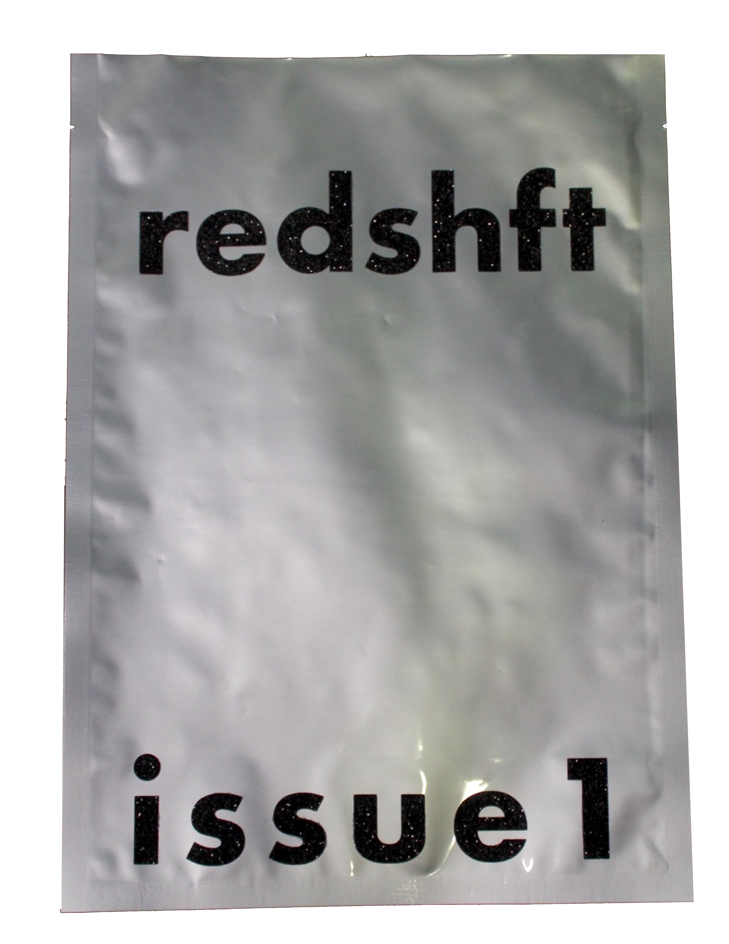 packaging for the magazine it is silver with glitter leters that read redshft>
</div>

<div class=